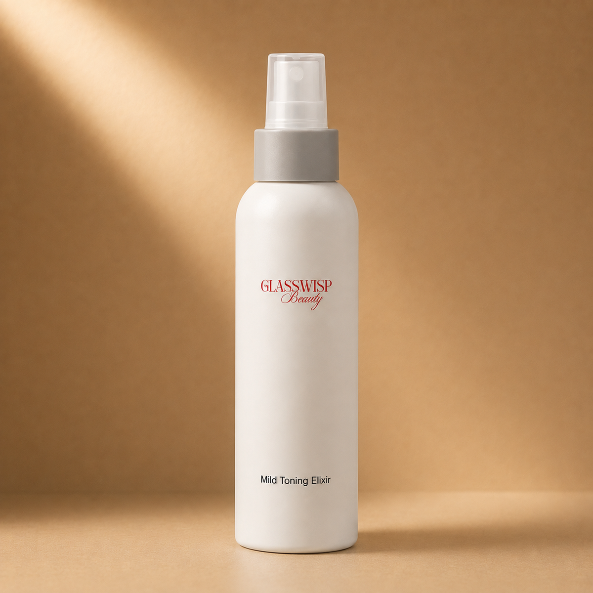 A white cylindrical spray bottle with a gray pump dispenser and clear cap, labeled 'GLASSWISP Beauty Mild Toning Elixir' in red and black text, set against a warm brown background with soft diagonal light rays.